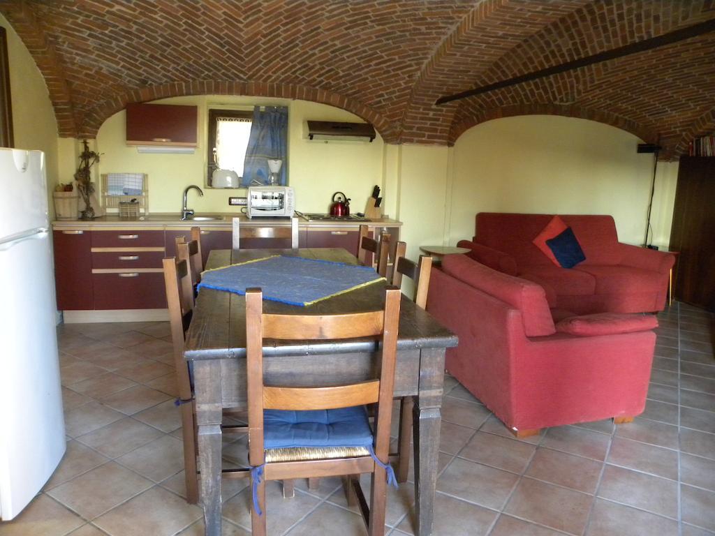 Agriturismo Fano'S Farm Suno Room photo