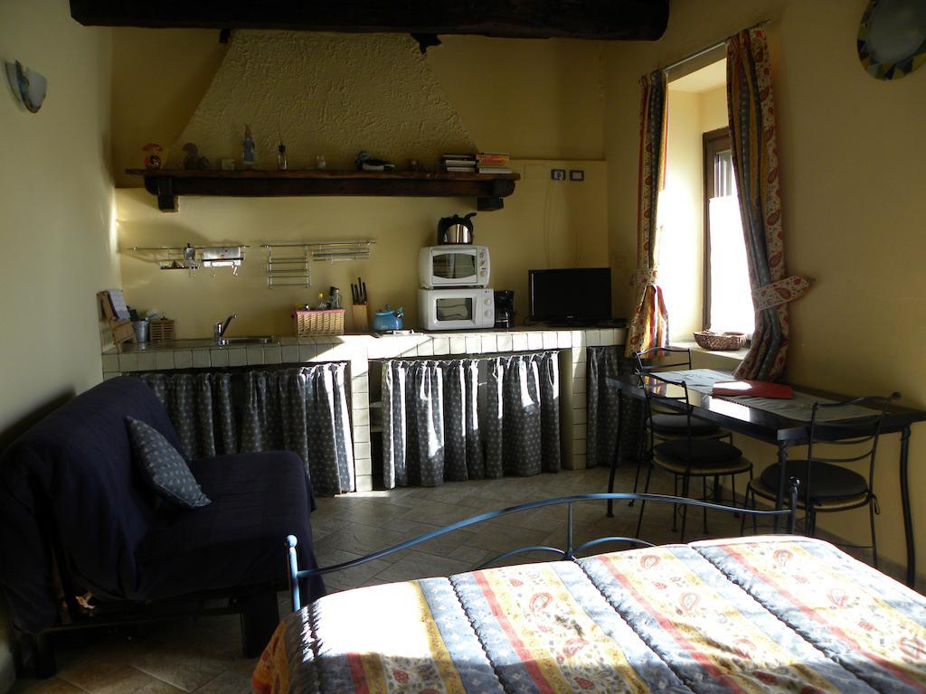 Agriturismo Fano'S Farm Suno Room photo
